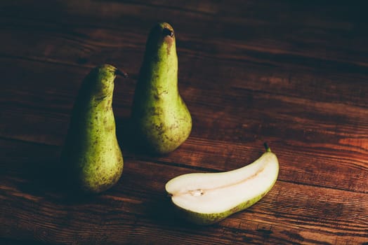 Still Life with Two Whole Conference Pears and One Halved.