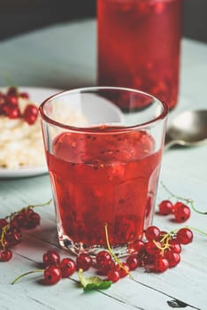 Simple and healthy breakfast with porridge and infused water with berries