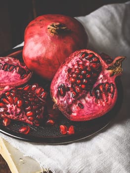 Pomegranate fruit on metal plate