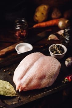 Raw chicken breast on baking sheet