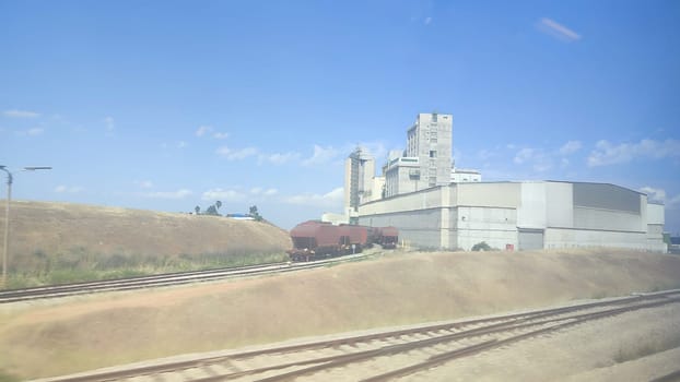 view of the desert railway and industrial plant, summer season landscape. High quality photo