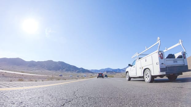 HWY 15, California, USA-December 3, 2022-Embarking on a road trip from Nevada to California, driving on Highway 15 during the day offers scenic views and an exciting journey between states.