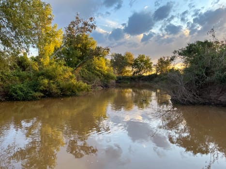 The arm of the Rio Prana near Rosario, sunny afternoon. Horizontal photo.wallpaper. Space for text. Banner for tourist promotion