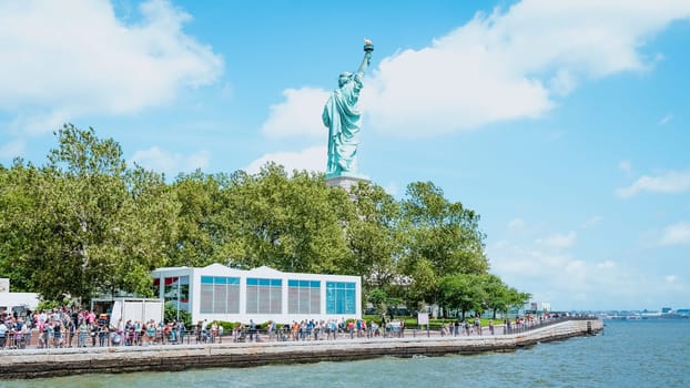 The Statue of Liberty, New York City on sunny blue sky. American symbol. Memorial day, Patriot Day. Space for text. New York NY USA 2023-07-30.