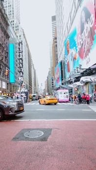New York City Street View of Residential Buildings and Passing Cars New York NY USA 2023-07-30.