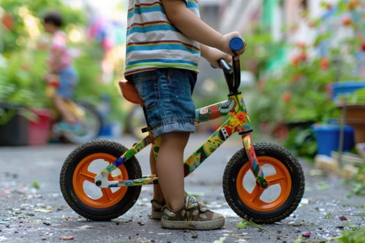 A child proudly displays their balance bike, adorned with colorful stickers and personalized accessories.