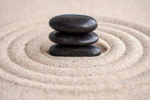 Zen stones stacking on sand with customizable space for text or message