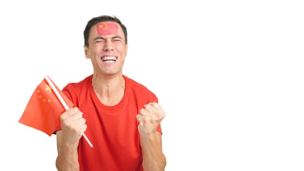 Man passionately cheering for China screaming and waving a national flag