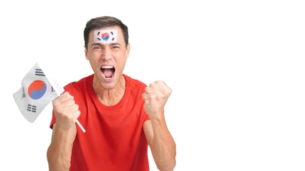 Man passionately cheering for South Korea screaming and waving a national flag