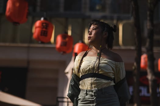 Portrait of an Asian woman against the background of Chinese lanterns