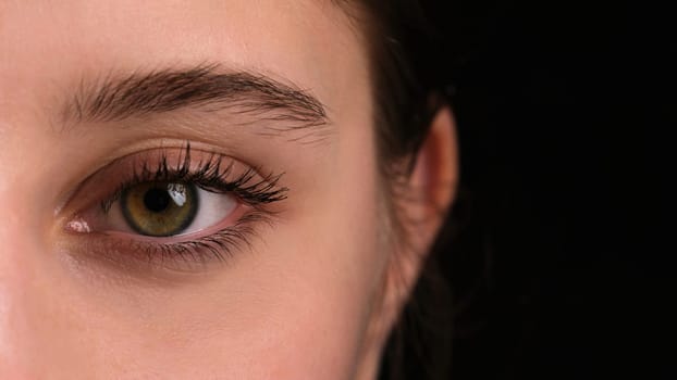 Close-Up Of A Girl'S Large Eye With Long Eyelashes