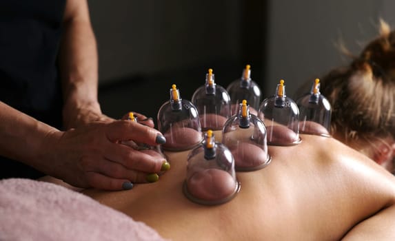 Vacuum Cupping Massage For Young Woman Line On A Massage Table