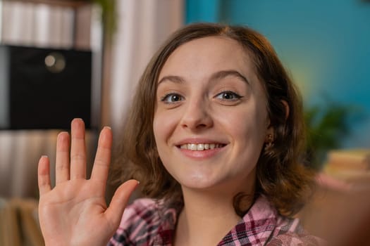 POV of young businesswoman working from home office looking at camera, making video webcam conference call with client or boss, enjoying pleasant conversation. Girl remote job online showing thumb up.