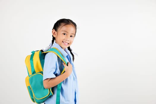 Portrait smiling Asian little girl kindergarten with schoolbag studio shot isolated white background, good job feedback, happy woman kid in pigtails wearing school uniform, back to school concept