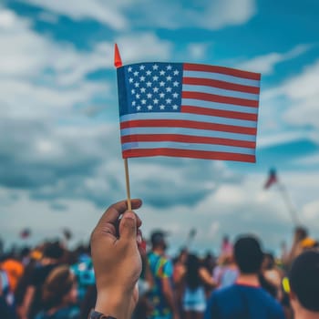 Focused image of a hand proudly holding a flag, of America is Independence Day