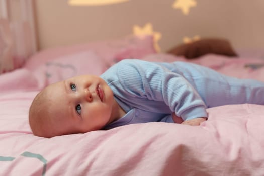Dream Baby Nestled Among Moon and Stars in Bed, going to sleep.