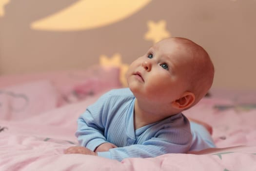 Dream Baby Nestled Among Moon and Stars in Bed, going to sleep.