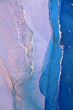 An abstract painting featuring flowing, swirling teal and silver ink. The artwork creates a sense of depth and movement, with light and dark areas intermingling.