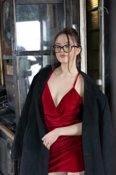 young beautiful woman posing in red lingerie in the studio