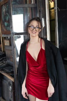 young beautiful woman posing in red lingerie in the studio