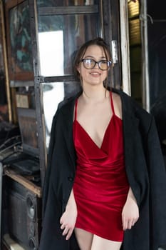 young beautiful woman posing in red lingerie in the studio