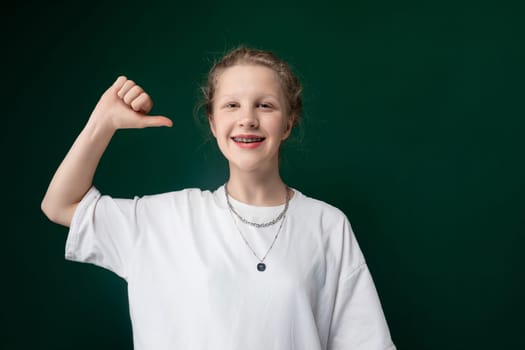 A woman lifting her fingers to form a peace sign gesture with her hand, symbolizing peace and unity. Her fingers are extended outward from a closed fist, creating the iconic symbol of peace and harmony.