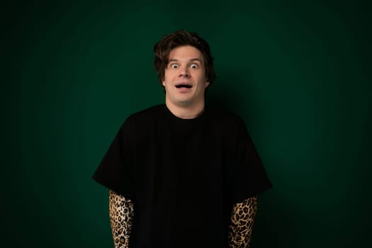 A middle-aged man with a surprised expression on his face, eyes wide and mouth slightly open. He appears shocked or astounded by something unexpected.