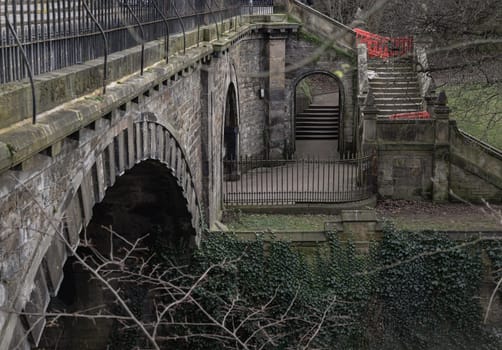 Edinburgh, Scotland - Jan 16, 2024 - A view of St.Bernards Bridge and the Water of Leith near Stockbridge and Dean Village in the city of Edinburgh. The peaceful scenery, Space for text, Selective focus.
