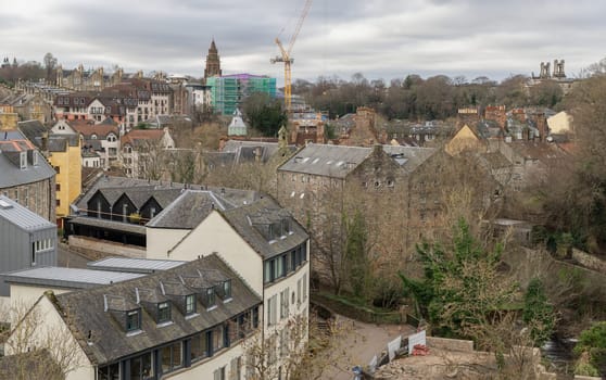 Edinburgh, Scotland - Jan 16, 2024 - Picturesque view of Dean Village on the Water and Leith from the Dean Bridge. Historic village and Beautiful scenery view, Amazing Edinburgh cityscape, Destinations in Europe, Space for text, Selective focus.