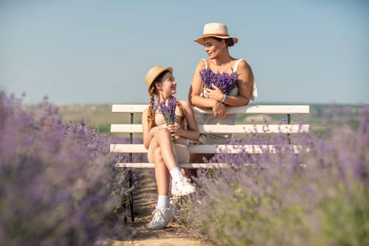 woman child sitting bench in field lavender. The woman is holding a bouquet of flowers, and the child is holding a bouquet as well. The scene is peaceful and serene