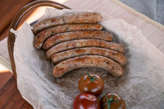 Grilled sausages with sauce and vegetables. Summer rest concept