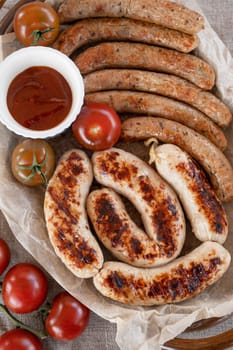 Grilled sausages with sauce and vegetables. Summer rest concept