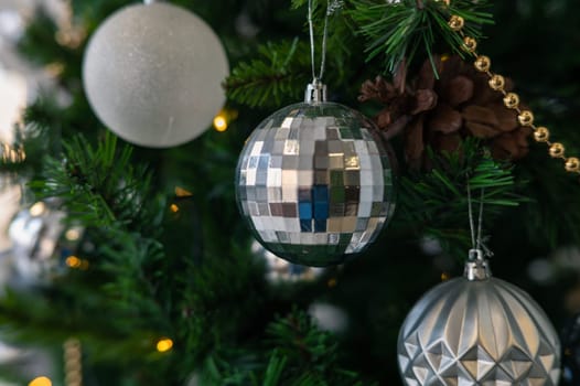 Christmas tree branch decorated with beauty balls and other christmas tree decoration