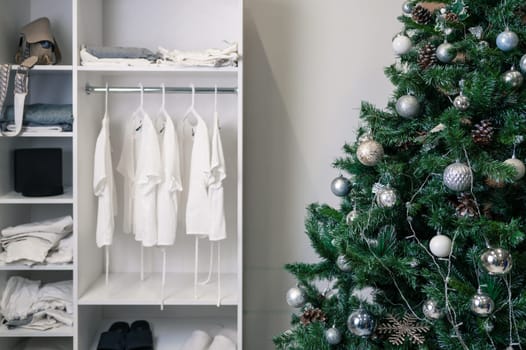Christmas tree with gifts in bedroom