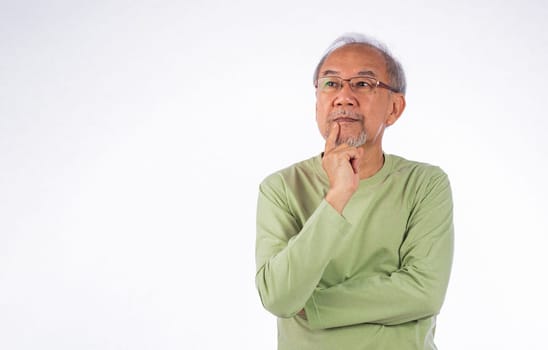 Portrait Asian grey haired with glasses senior man face thinking about something studio shot isolated on white background, elderly with a thoughtful expression holds chin thinking about question