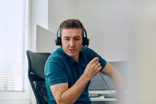 A detailed close-up captures a focused customer support representative wearing a headset while providing assistance in a call center setting.