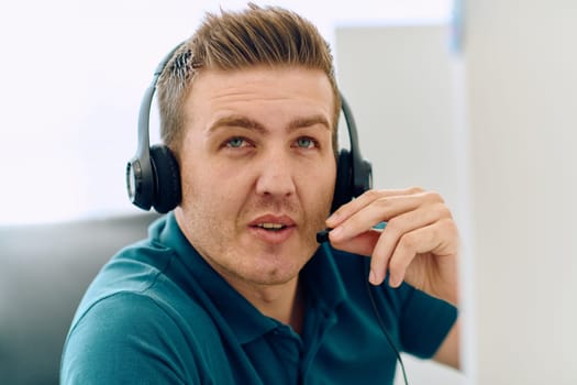 A detailed close-up captures a focused customer support representative wearing a headset while providing assistance in a call center setting.