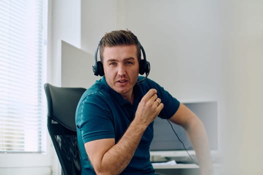 A detailed close-up captures a focused customer support representative wearing a headset while providing assistance in a call center setting.