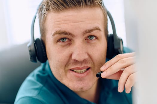 A detailed close-up captures a focused customer support representative wearing a headset while providing assistance in a call center setting.