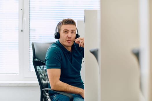 A detailed close-up captures a focused customer support representative wearing a headset while providing assistance in a call center setting.