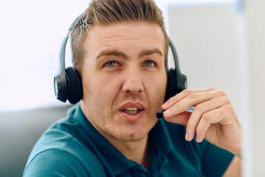 A detailed close-up captures a focused customer support representative wearing a headset while providing assistance in a call center setting.