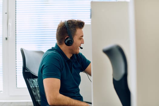 A detailed close-up captures a focused customer support representative wearing a headset while providing assistance in a call center setting.