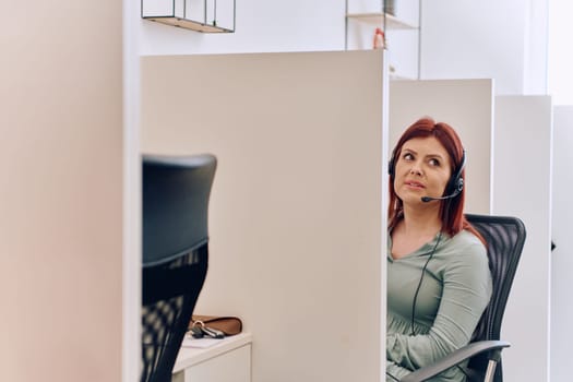 A female call center agent can be seen providing dedicated support and assistance to customers, aiding them in resolving various issues they encounter.