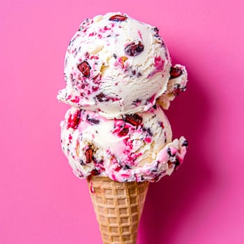 Scoops of ice cream in a waffle cone on a colorful background