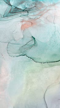 A close-up of abstract ink swirls in shades of aqua, blue, and rose. The ink has been carefully blended to create a unique and beautiful pattern.