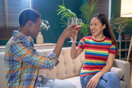 Two best friends toasting With Glass Of Wine At Home. High quality photo