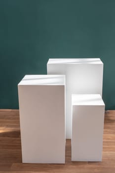 Product photography mockup. White bases against green background. High quality photo