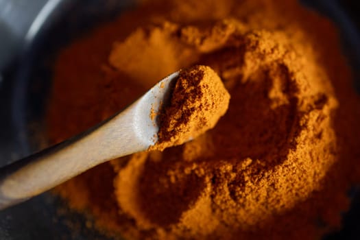 Red paprika powder.Zenithal image .Brochure for spices and asian or indian food promotions.Concept of spices and flavours. Space for text.