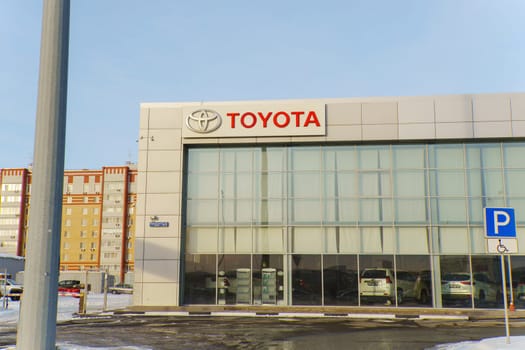 Tyumen, Russia-March 02, 2024: Toyota logo Sign Against Blue Sky. Selective focus