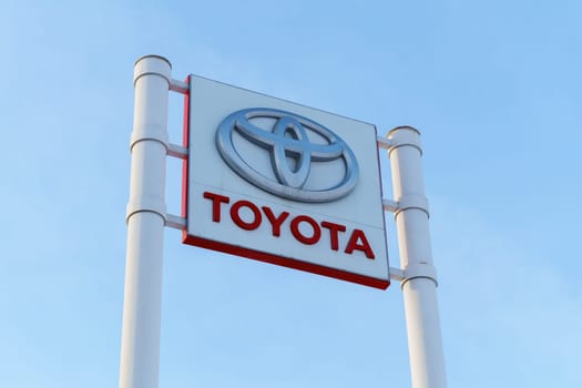 Tyumen, Russia-March 02, 2024: Toyota logo Sign Against Blue Sky. Selective focus